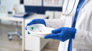 healthcare professional holding medical tray